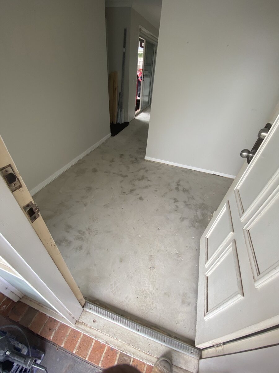Room after tile removal and floor preparation
