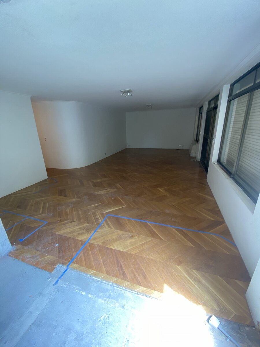 Room with parquet flooring before removal