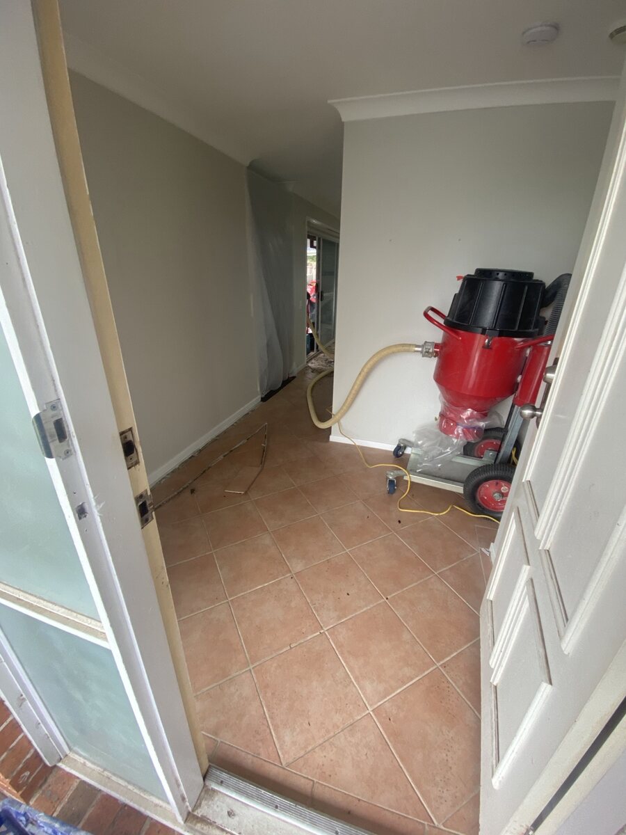 Tiled room before floor removal